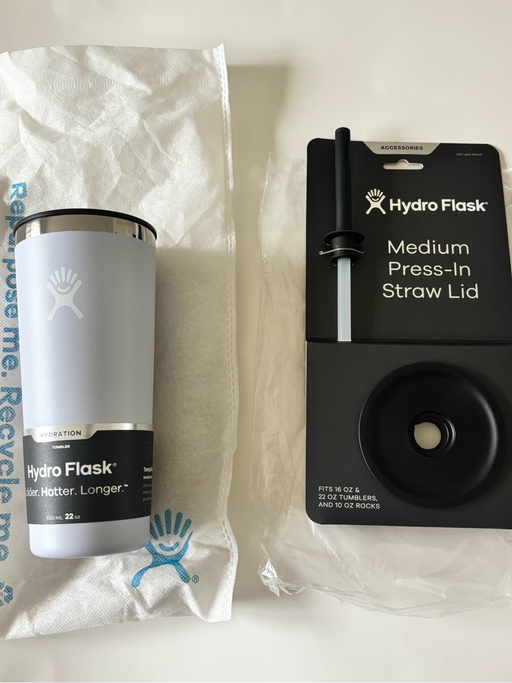 Hydro Flask 22 oz tumbler in light blue with silver lid & medium press in lid